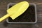 Seeds and ground in a box. Seedling. Gardening. Yellow shovel. Growing