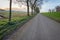 Seemingly endless country road during sunset