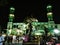 seen from afar the splendor of the grand mosque with the color of the green building at night