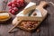 Segment of Brie cheese or soft cow`s - French camembert  on wooden board with  grapes, honeycomb and pecan nuts