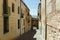 Segovia, Spain. A small street with a panorama of the surrounding hills.