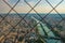 The seine in Paris behind the Eiffel towers fence.