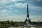 Seine River, Eiffel Tower and gardens under sunny blue sky, seen from the Trocadero in Paris.