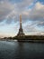 Seine river panorama view of Eiffel tower steel structure construction landmark symbol Champ de Mars Paris France Europe