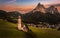 Seis am Schlern, Italy - Aerial panoramic view of St. Valentin Church and famous Mount Sciliar mountain at background