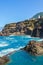 Seixal, Madeira, Portugal - Sep 13, 2019: Couple swimming in a natural swimming pool in the Atlantic ocean. Pools made up of