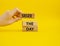 Seize the day symbol. Wooden blocks with words Seize the day. Beautiful yellow background. Businessman hand. Business and Seize