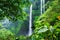 Sekumpul waterfall, Bali island, Indonesia. Natural tropical landscape at the summer time. High waterfall and forest Mountains and