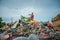 Selat Panjang, Riau Indonesia on January 03, 2022, A scavenger is working on a pile of plastic waste along with thousands of flies