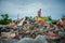 Selat Panjang, Riau Indonesia on January 03, 2022, A scavenger is working on a pile of plastic waste along with thousands of flies