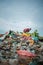 Selat Panjang, Riau Indonesia on January 03, 2022, A scavenger is working on a pile of plastic waste along with thousands of flies