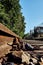 Seldom used, weathered railway line that is gradually overgrown by plants.