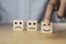 Select emotion or mood concept , Hand holding smile face  or happy face which print screen on wooden cube block