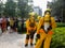 Select focus of back Firefighters in yellow suit with an oxygen tank in the back. Firefighters are teaching office workers to esca