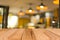 Selected focus empty brown wooden table and Coffee shop blur bac