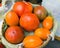 Selected fresh tomatoes in a wicker basket in the market