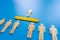 Selected wooden figure on blue background. The concept of finding an employee in business. HR manager search employee. Group