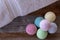 Selection of colorful bath bombs on weathered wood.