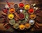 selection of colorful spices on a wooden table.