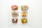 Selection of Danish smorrebrod open sandwiches on parchment paper on white background