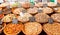 Selection of dried fruits and nuts in bowls on a market stall.