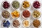 Selection of dried herbs on a white background, top view