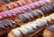 Selection of eclairs with cream and various candy toppings.Macro.AI Generative