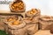 Selection of Fresh baked bread baskets and paper bags with bread roasted in the oven, croissants