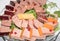 Selection of fresh cuts antipasto: ham, cheese