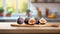 A selection of fresh fruit: fig, sitting on a chopping board against blurred kitchen background copy space