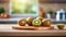 A selection of fresh fruit: kiwi fruit, sitting on a chopping board against blurred kitchen background copy space