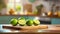 A selection of fresh fruit: lime, sitting on a chopping board against blurred kitchen background copy space