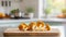 A selection of fresh vegetable: chanterelle mushroom, sitting on a chopping board against blurred kitchen background copy space