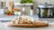 A selection of fresh vegetable: enoki mushroom, sitting on a chopping board against blurred kitchen background copy space