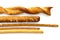 Selection of grissini, pretzels and cheese sticks on white from