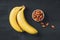 Selection of healthy food for heart. Bananas and almond on black