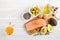 Selection of healthy unsaturated fats, omega 3 - fish, avocado, olives, nuts and seeds.