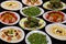 Selection of libanese arabic food mezze, includes hummus, muhammara, moutabal, taboule and vine leaves