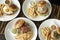 Selection of many different burgers on restaurant table