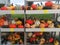 A selection of medium sized pumpkins and gourds for sale at a farmer`s market.