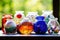 a selection of multicolored marbles in glass jars