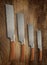 A selection of precision carpentry hand saws on a wooden backdrop