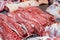 Selection of quality meat in a butcher shop. Different types of fresh meat are on display. Meat assortment