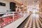 Selection of raw fresh veal meat in the refrigerated display of a butcher shop