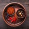 Selection of spices pepper. Food background on black wood table. Top view