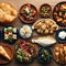 Selection of traditional greek food salad, meze, pie, fish, tzatziki, dolma on wood background, top view