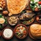 Selection of traditional greek food salad, meze, pie, fish, tzatziki, dolma on wood background, top view