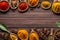 A selection of various colorful spices on a wooden table. Generative AI