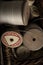 A selection of vintage wooden cotton reels in a basket