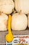 Selection of white pumpkins and a yellow gourd